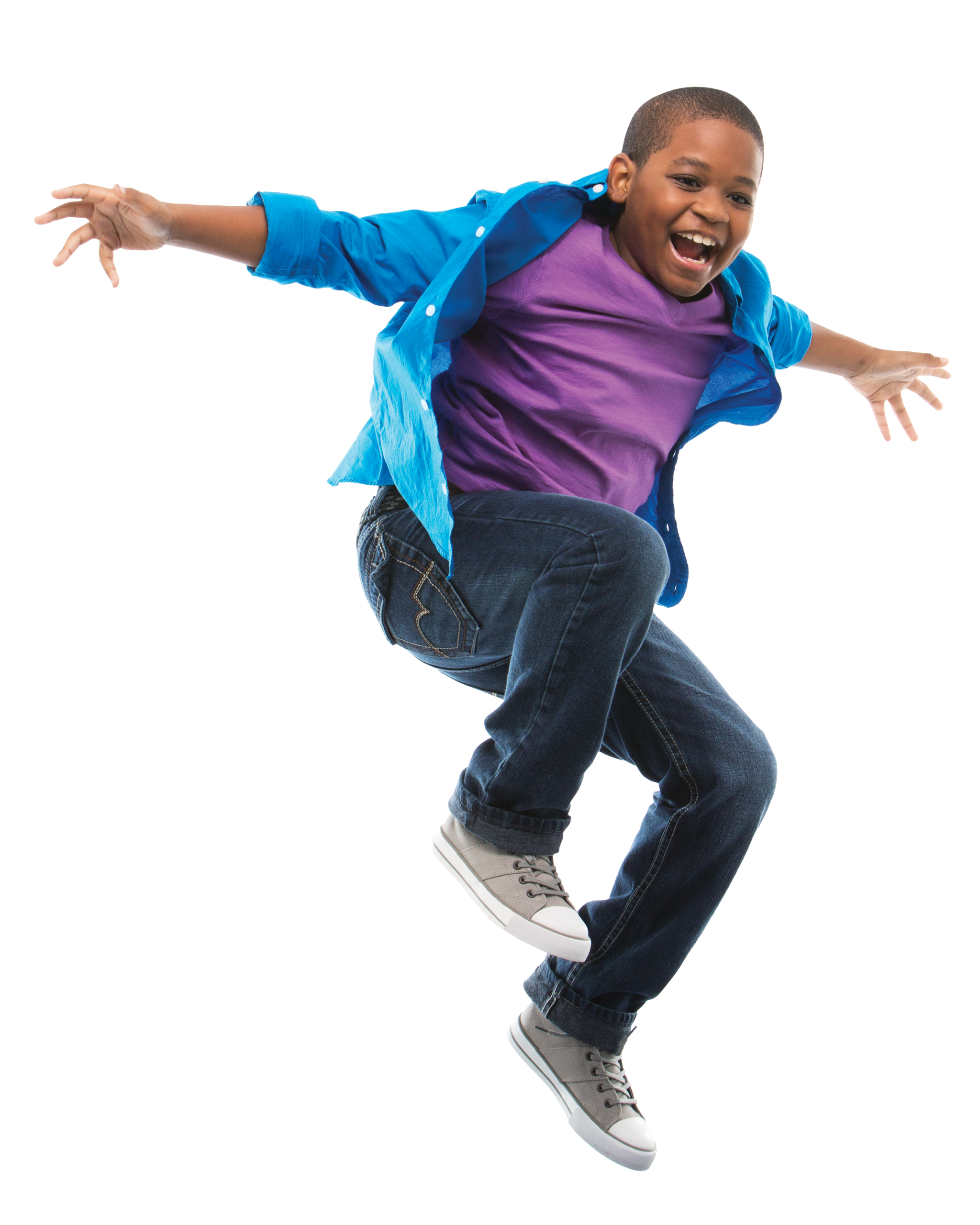 Young boy jumping into the air.