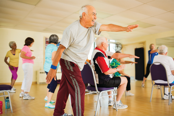 Older adults having fun in a fitness class.