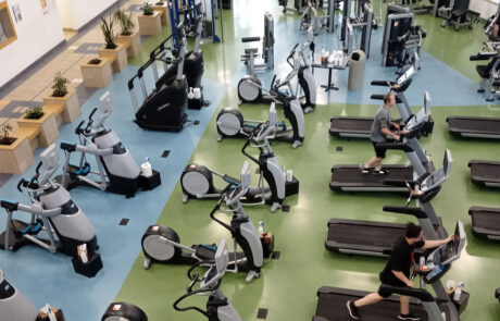 YMCA members working out on treadmills in YMCA gym.