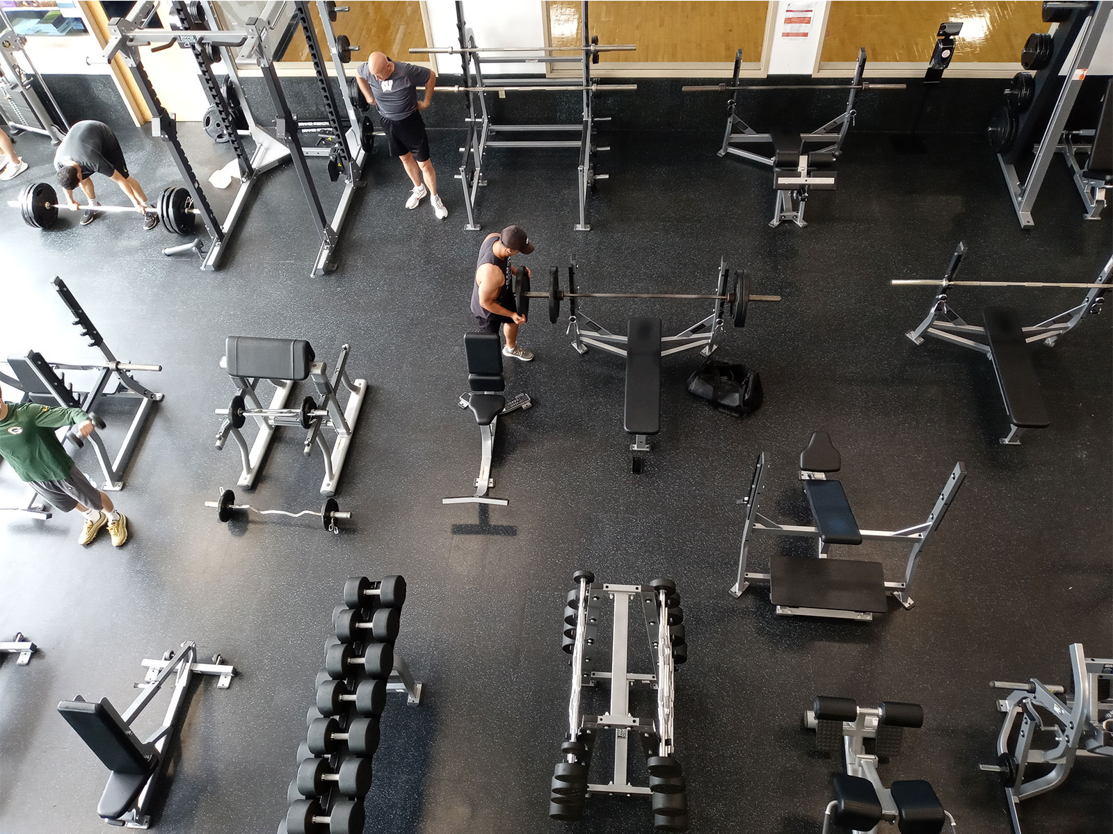 Men working out in YMCA gym. Men working out in YMCA gym.