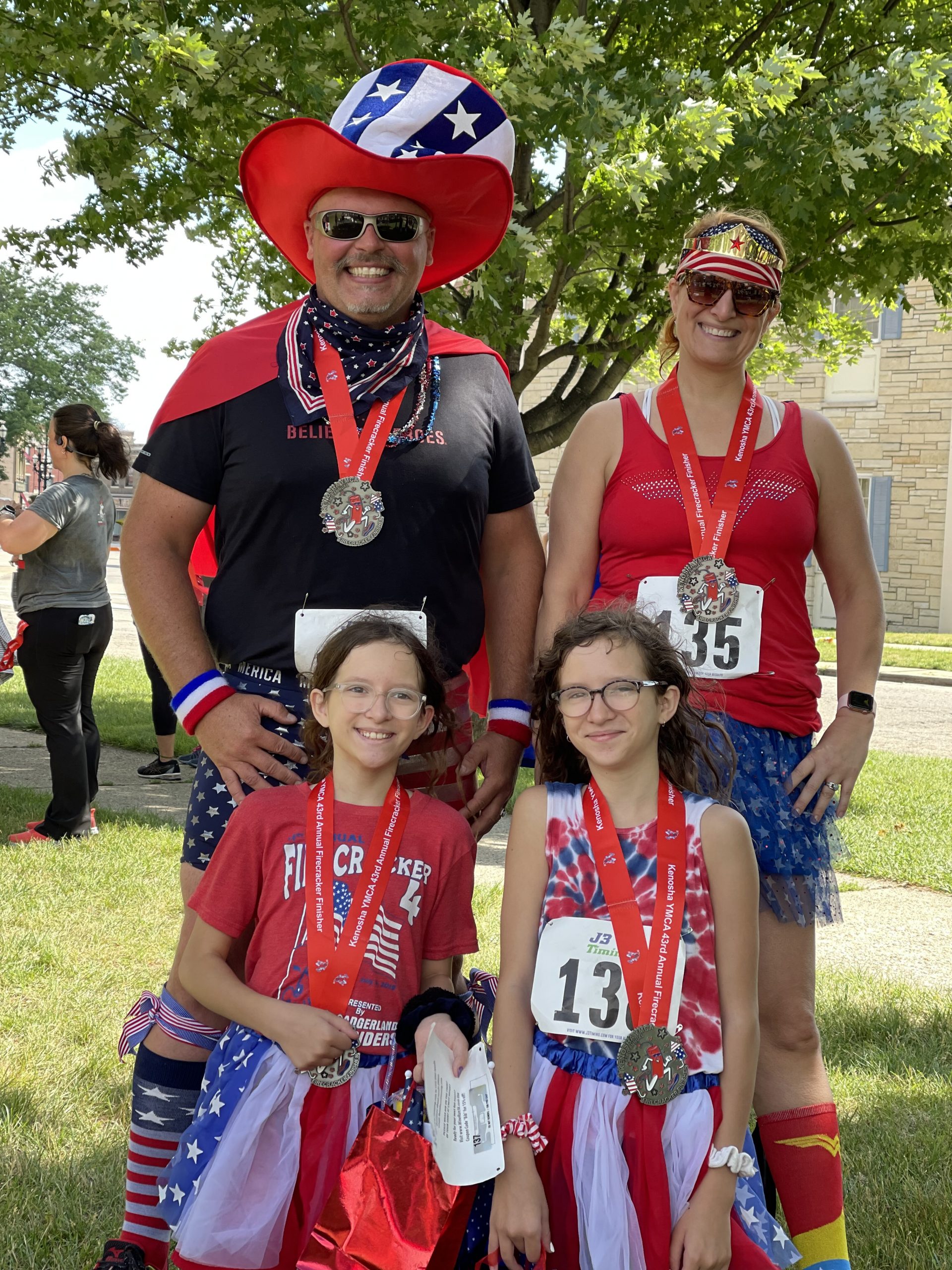 Two adults and two girls who won Spirit Award Winners.