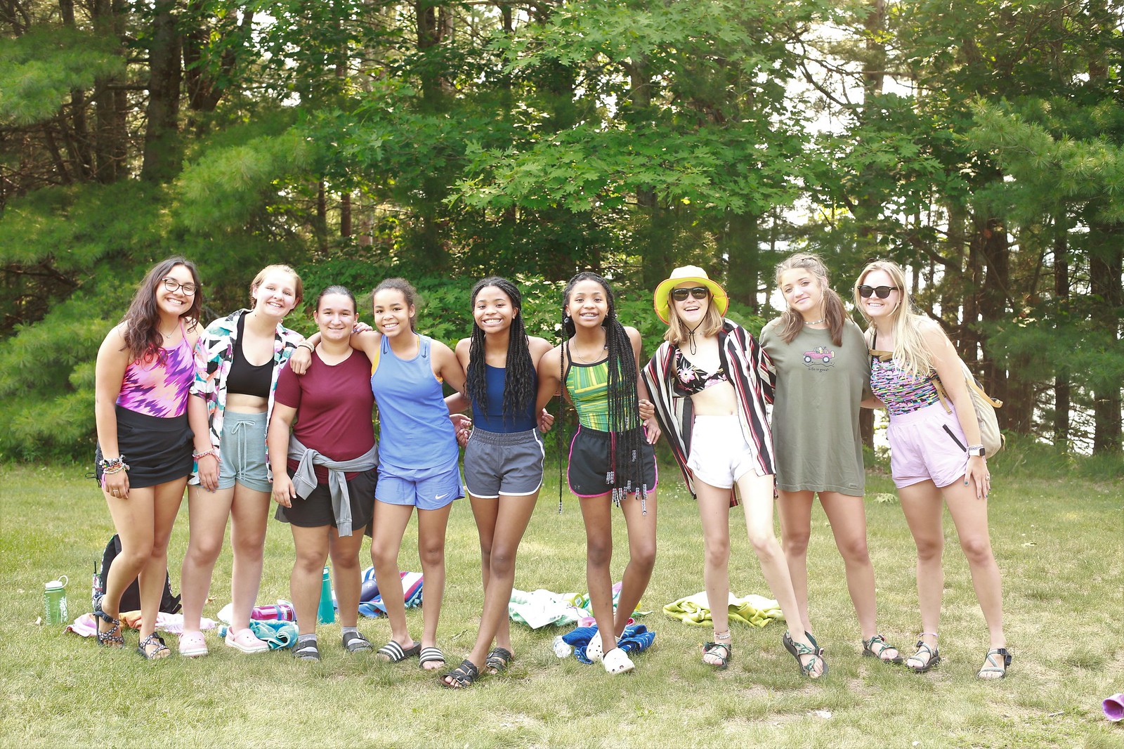 A big group of girls smiling posing together at the YMCA Camp Jorn.