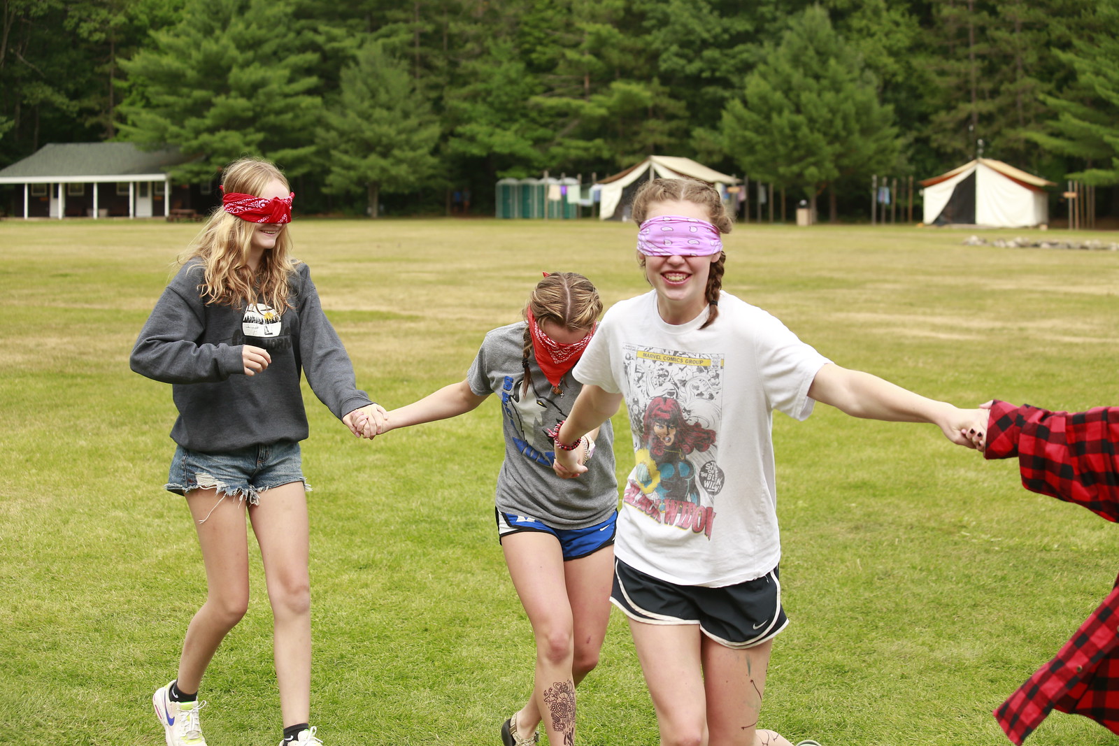 Girls blindfolded playing a fun game at YMCA Camp Jorn.