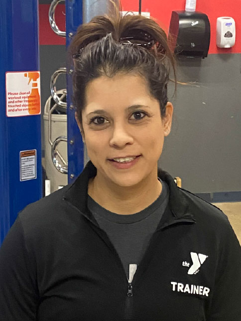 Smiling woman who is a YMCA personal trainer. Smiling woman who is a YMCA personal trainer.