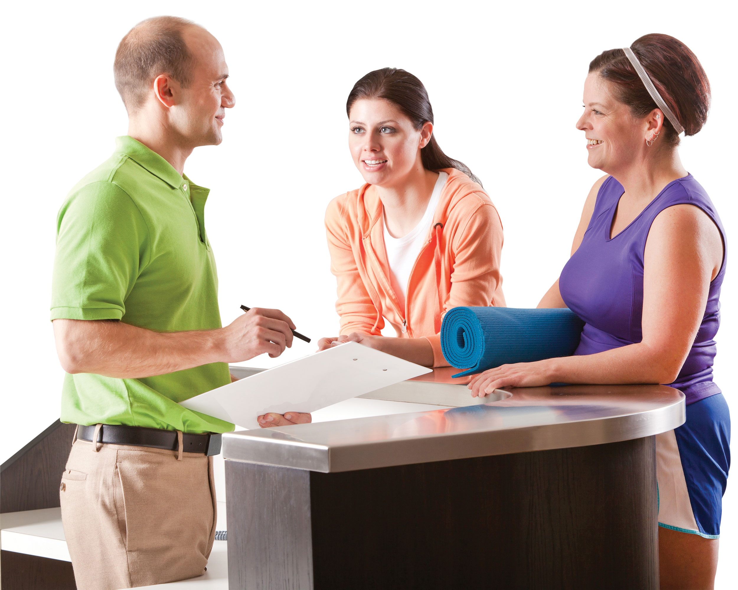 Two women checking in for a fitness class at the members desk with a man.