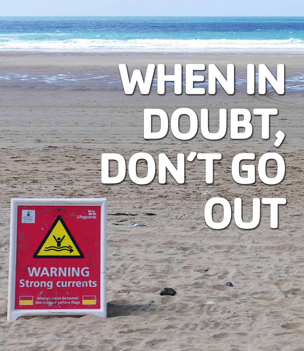 "When in Doubt don't go out" with a Sign on the beach with a strong current warning and logos of organizations promoting water safety