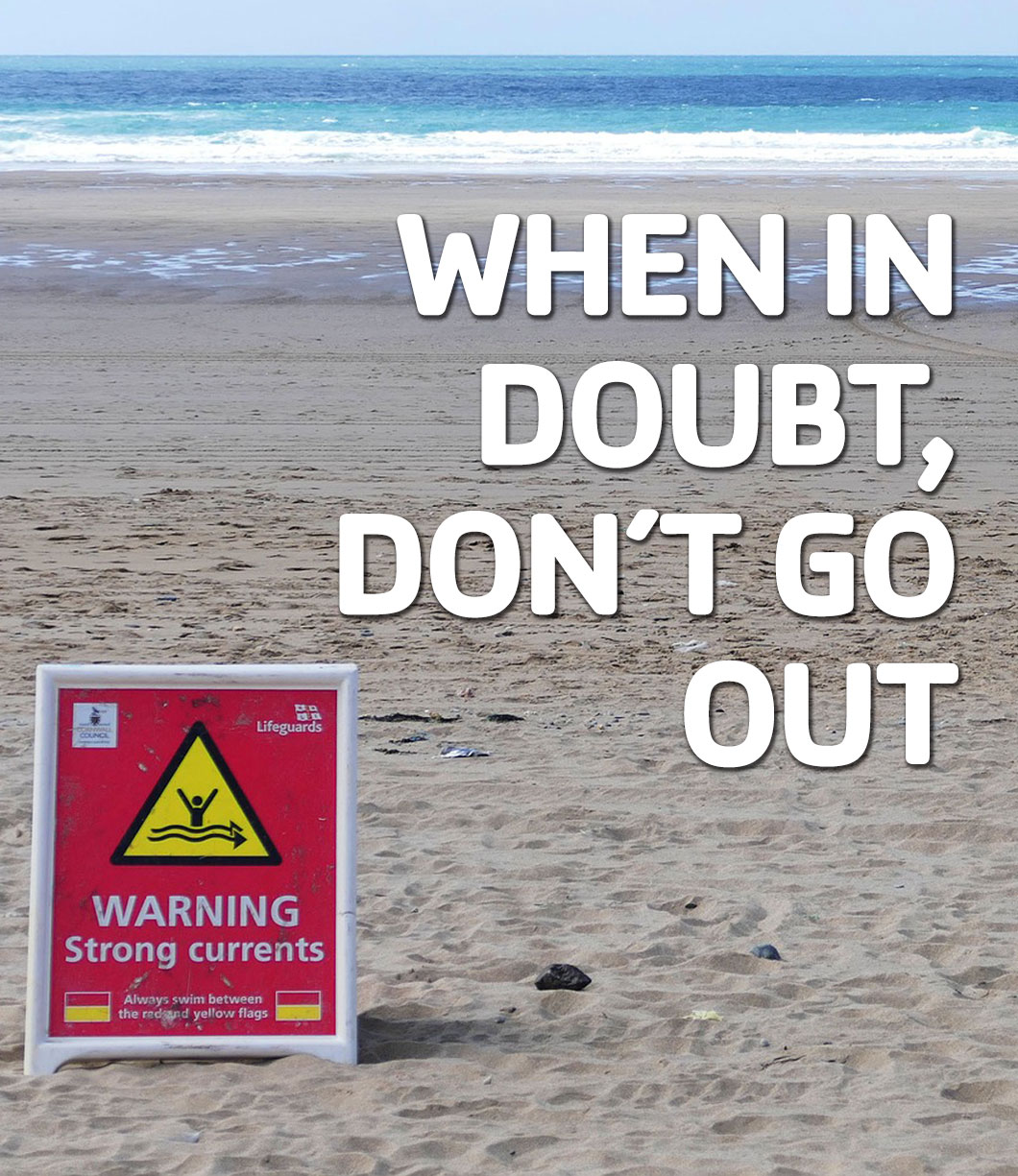 When In Doubt "When in Doubt don't go out" with a Sign on the beach with a strong current warning and logos of organizations promoting water safety