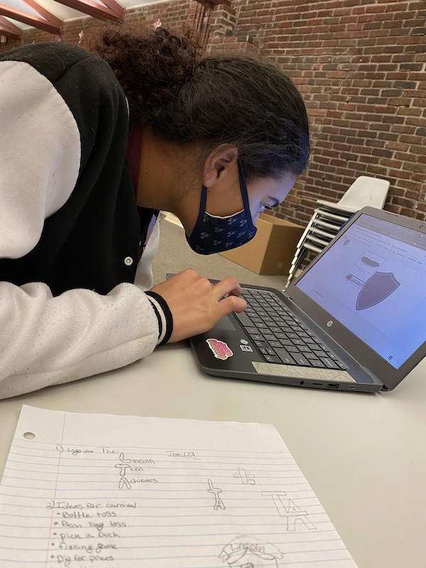 Teen girl in the YMCA Achievers Program working on the computer.